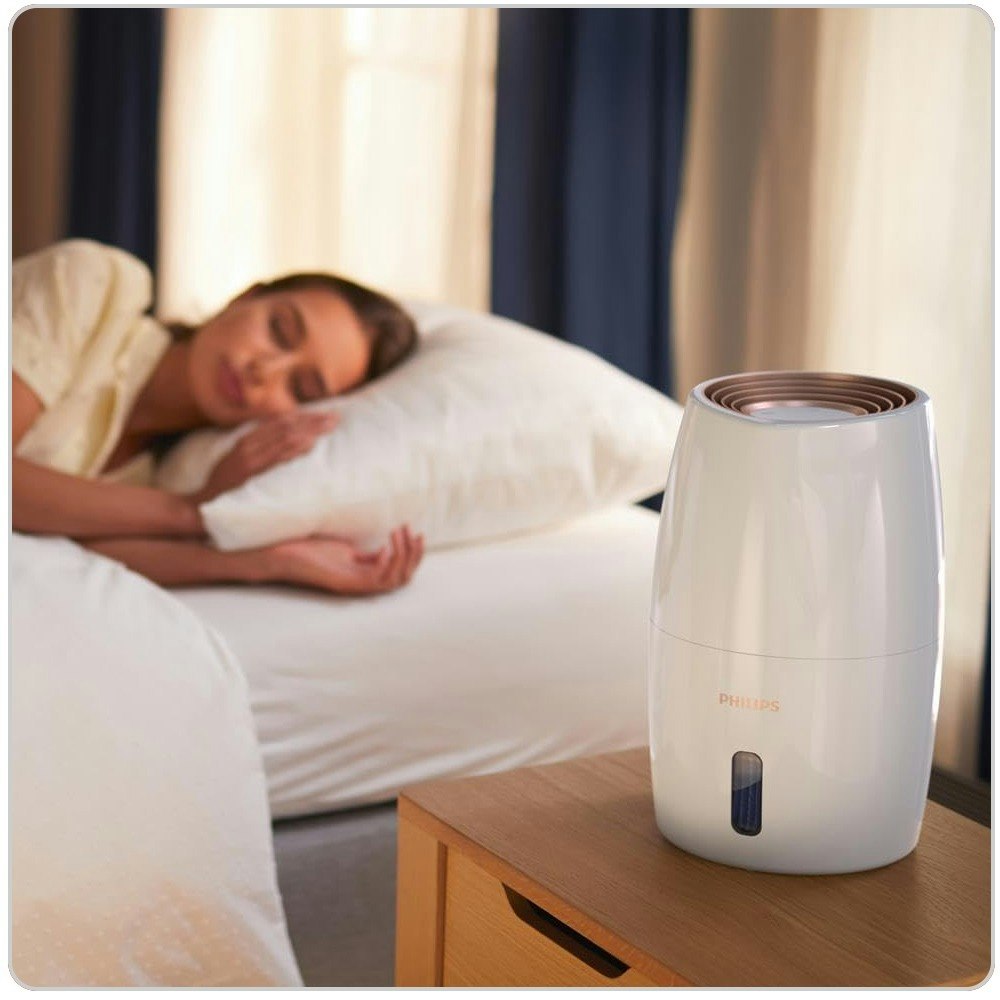 A family in the living room with an Air Purifier