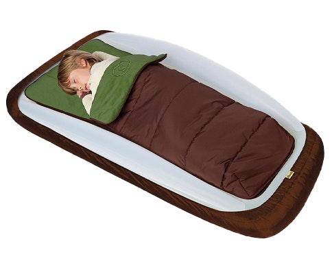 Boy carrying the Shrunks Outdoor bed for camping