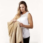 Bucky 2 in 1 Pillow and Travel Blanket Combo on Woman 1