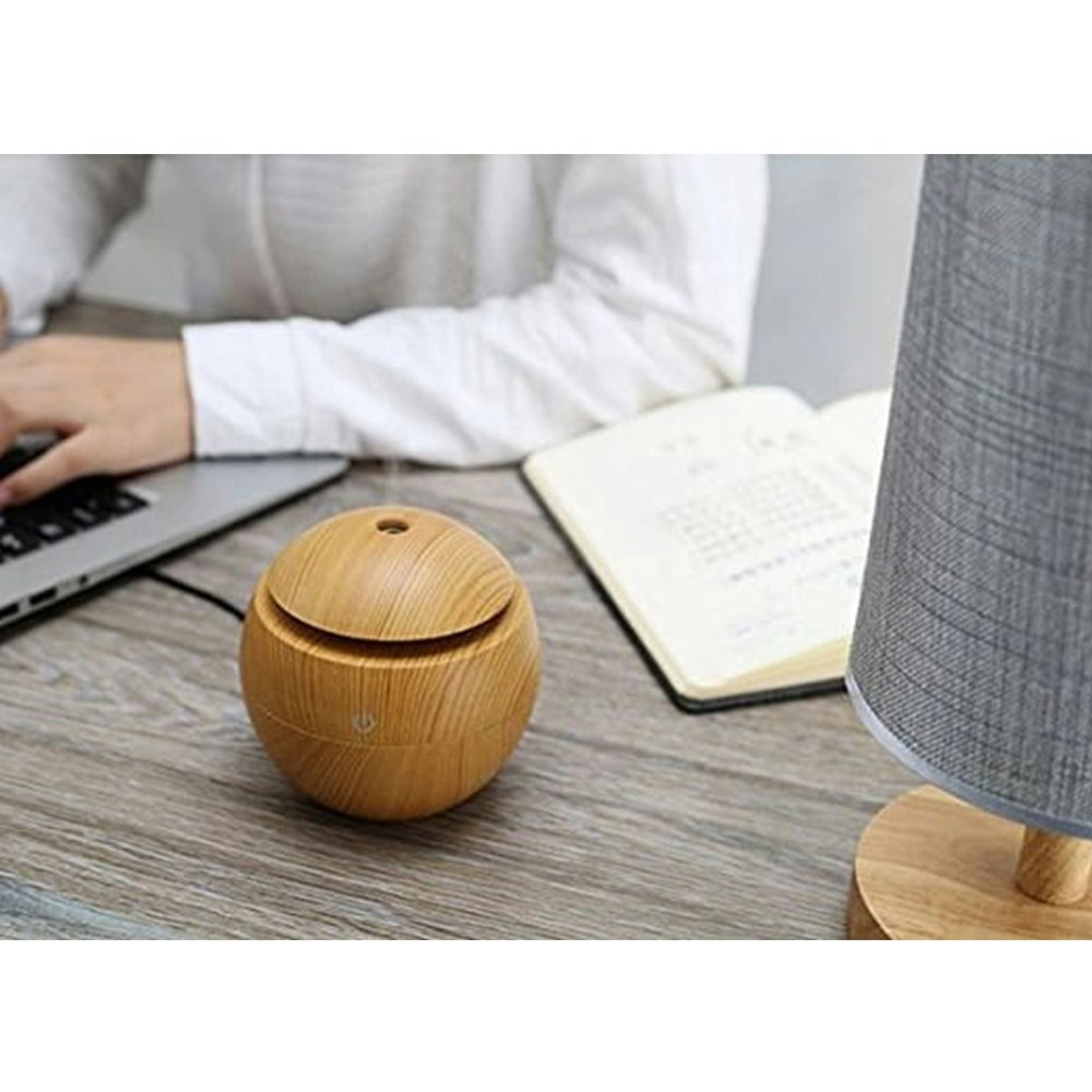 Sphere Aromatherapy Diffuser with Essential Oils on the Table